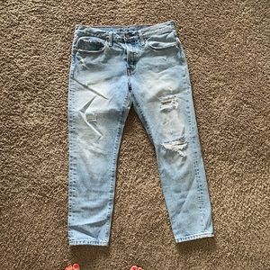 Levi tapered distressed jeans